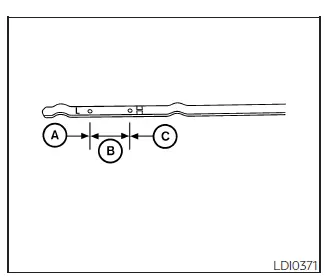 Nissan Frontier engine oil dipstick high and low level marks