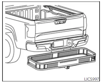 Nissan Frontier cargo carrier attached to towing hitch