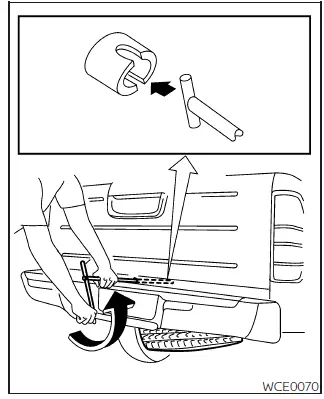 Nissan Frontier spare tire winch access with jacking rod