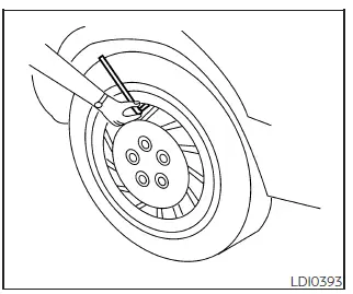 Nissan Frontier tire pressure gauge checking valve stem pressure