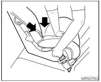Nissan Frontier tightening rear-facing child restraint using seat belt step 5